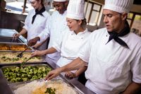 group-of-chefs-stirring-prepard-foods-in-kitchen-a-2021-08-28-16-47-38-utc